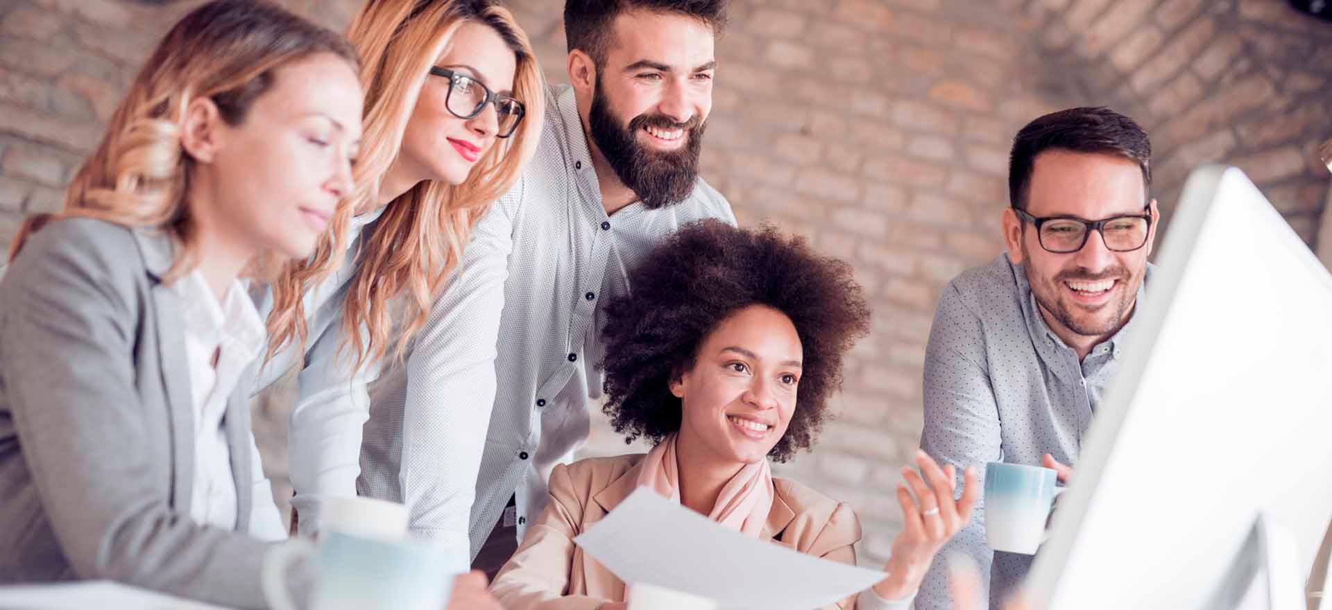 Group of young business people work together in office.
